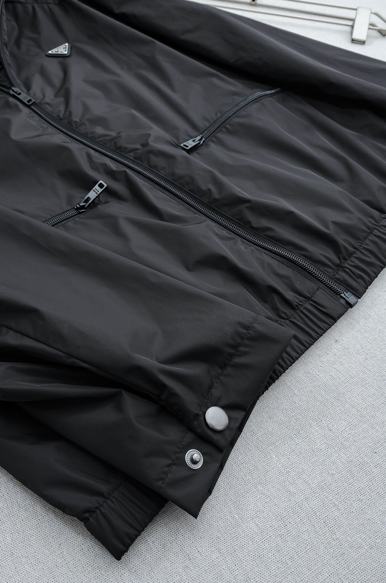 Prada long jacket with snap cuffs and side seam zipper detail