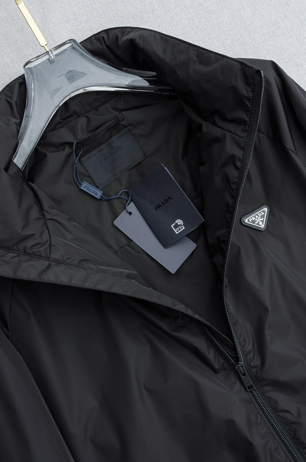 Prada long jacket interior lining with visible front zipper and dark shell