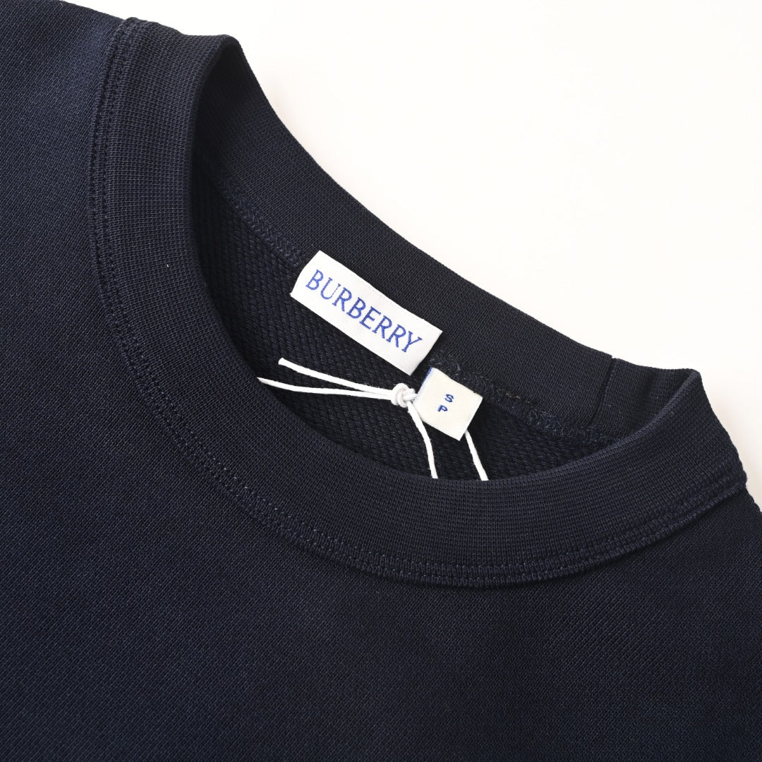 Ribbed crew neckline on a dark navy sweatshirt with interior brand label