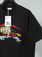Black T-shirt with large horse-and-rider print on front.