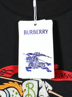 Black T-shirt tag and neckline with BURBERRY logo and crest graphic.