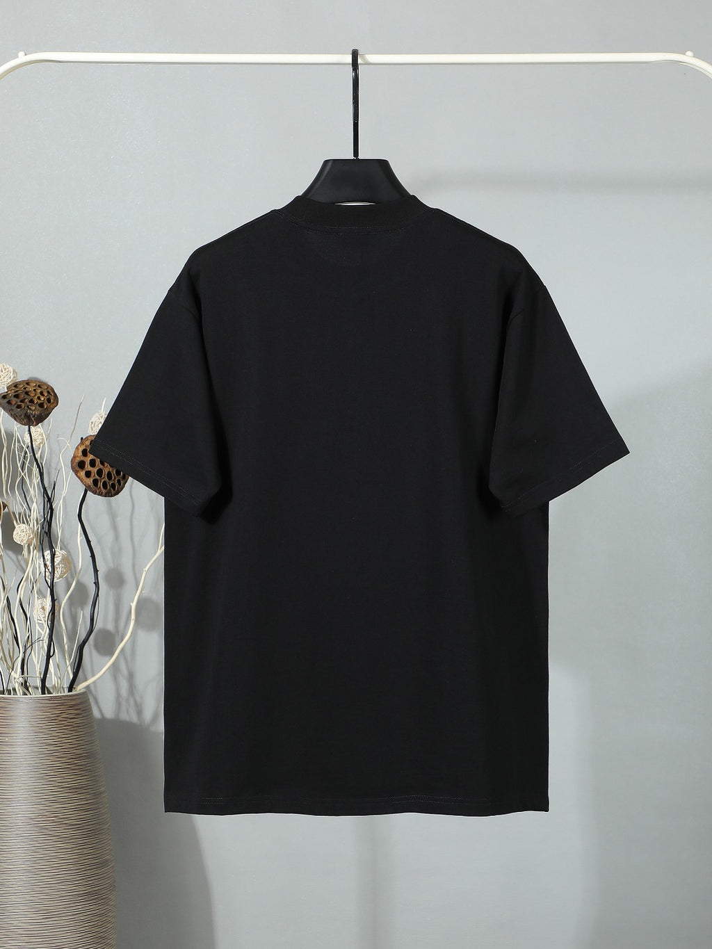Black short-sleeve T-shirt, plain back view.
