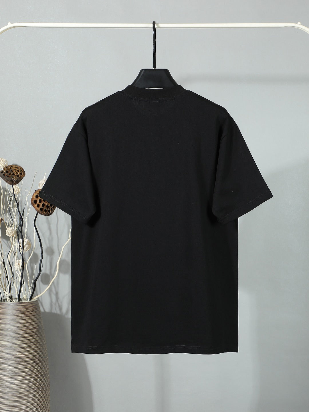 Black short-sleeve T-shirt, plain back view.