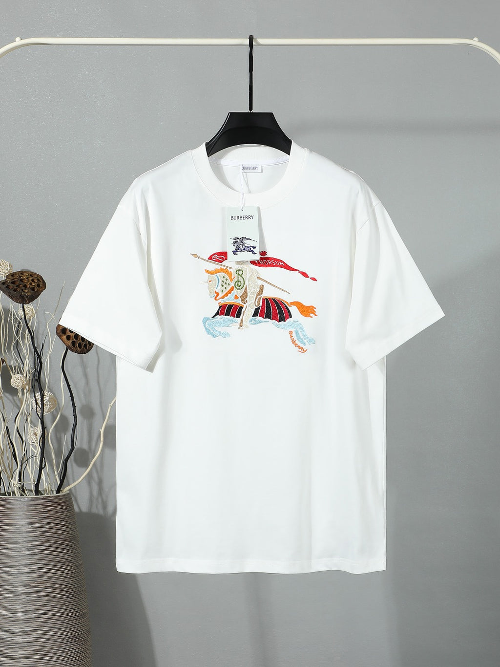 White crewneck T-shirt with multicolor horse and flag graphic