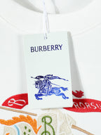 White T-shirt neck tag with Burberry text and colorful horse embroidery