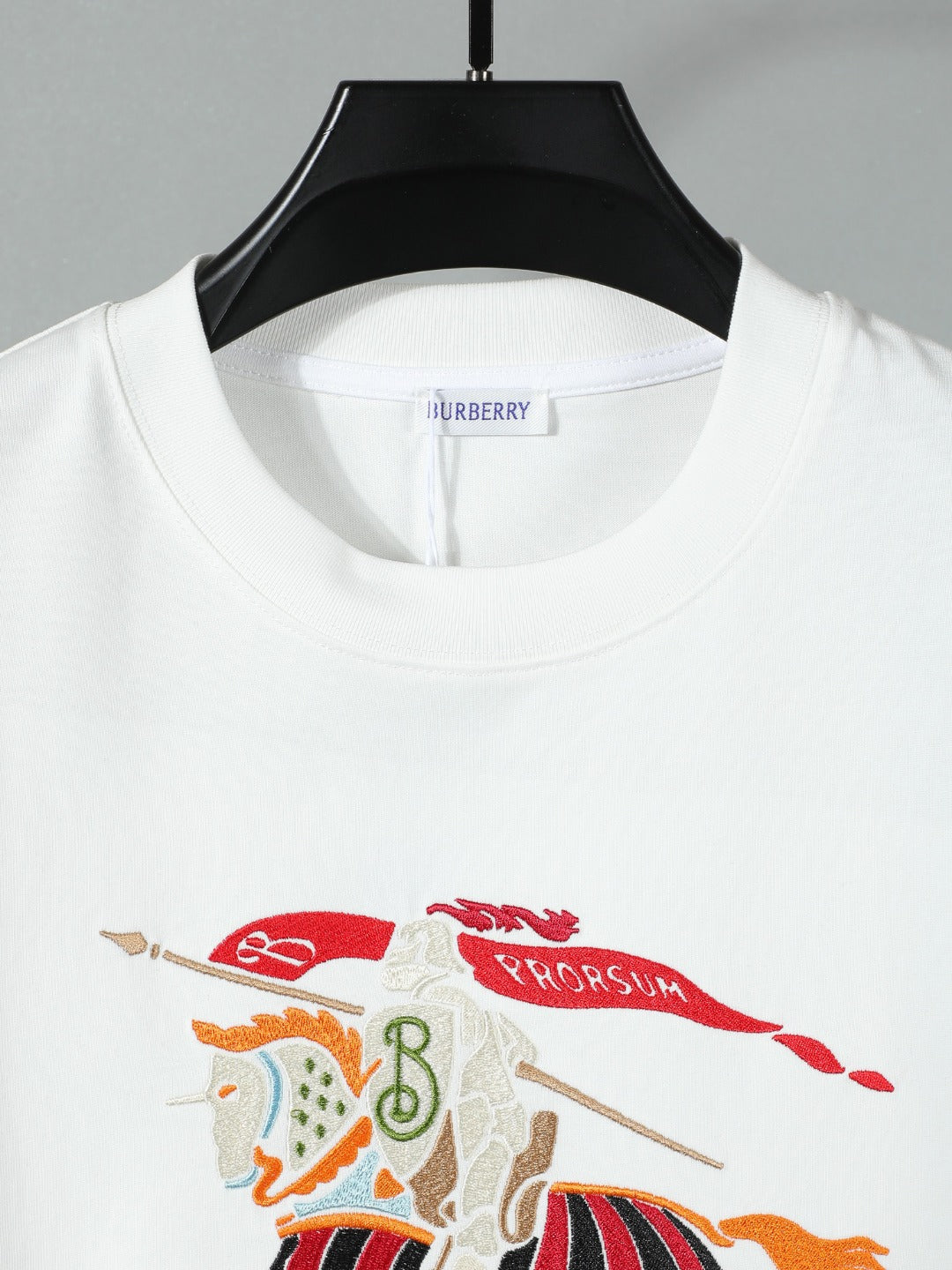 White crewneck T-shirt with Burberry neckline label and horse graphic