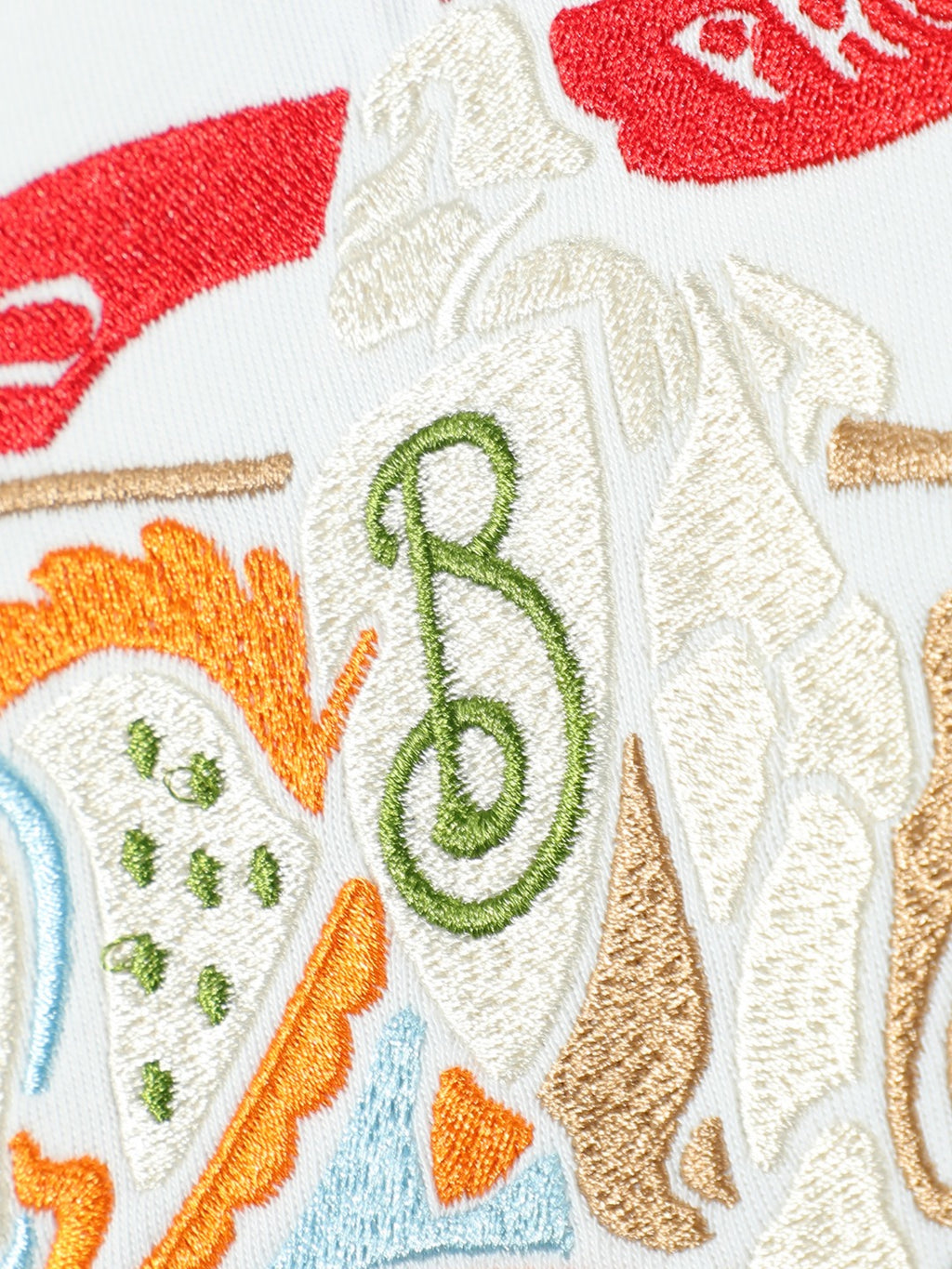 White T-shirt embroidery with green letter B and illustrated horse scene