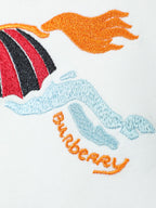 White T-shirt embroidery close-up of orange horse and blue wave