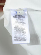 White T-shirt inside care label with Burberry branding and fabric details