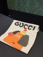 Cream short-sleeve T-shirt folded with Gucci logo and cartoon graphic