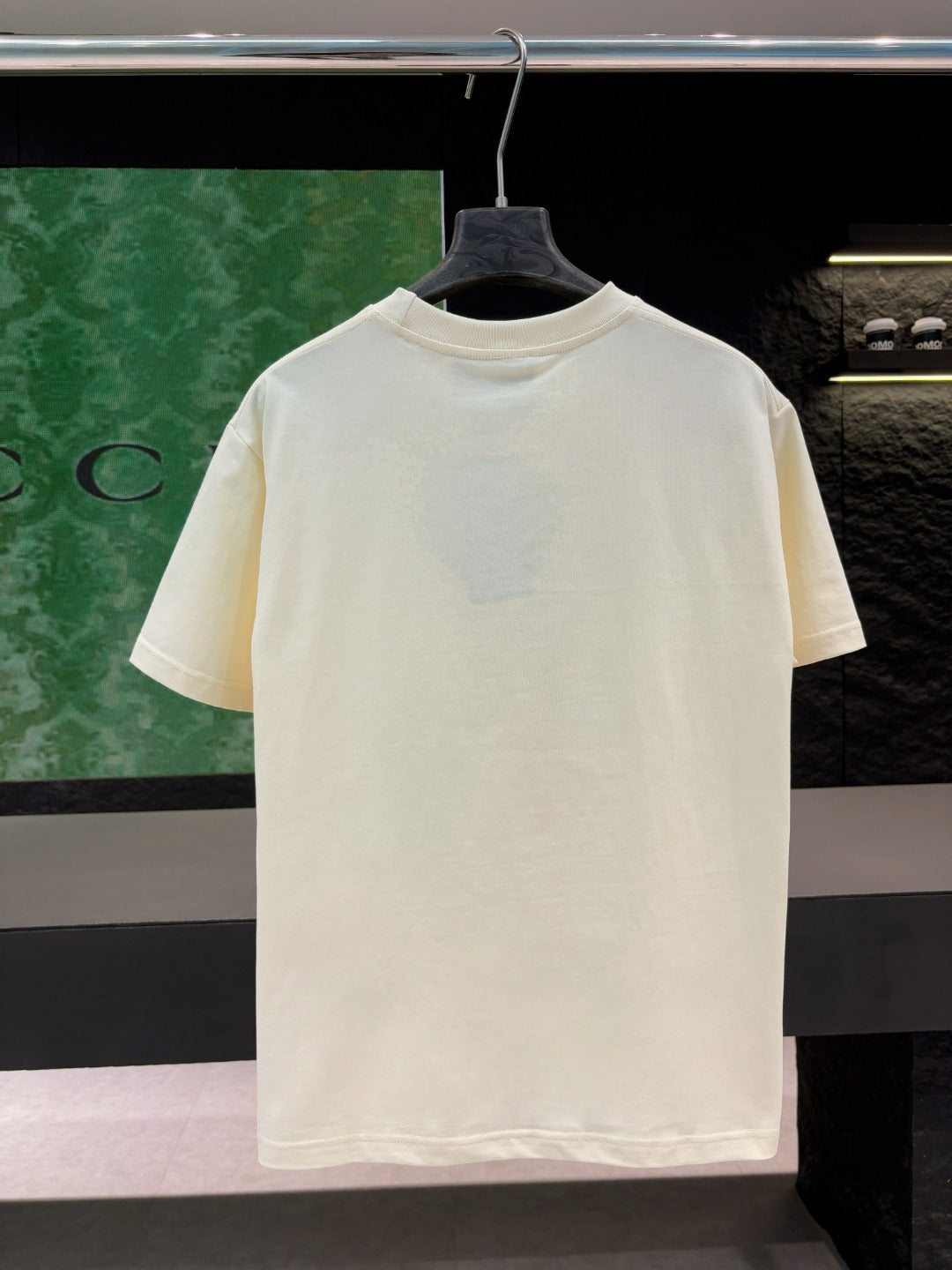 Cream short-sleeve T-shirt on hanger, plain front