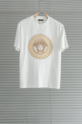 Versace white T-shirt with gold Medusa-style circular graphic on the chest