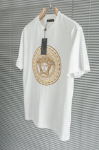 Versace white T-shirt on hanger with gold Medusa-style circular chest graphic