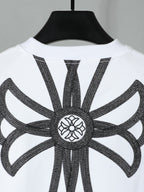 White short-sleeve T-shirt with large black angel-like embroidery graphic on back