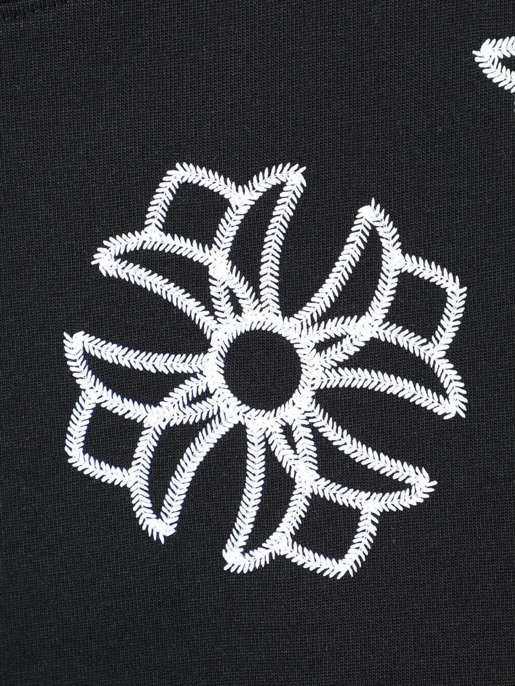 Black short-sleeve T-shirt with large white flower embroidery motif