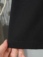 Dark fabric shorts hem with visible stitching