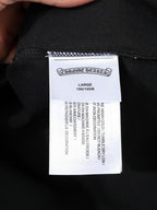 Large size label inside dark shorts with care instructions
