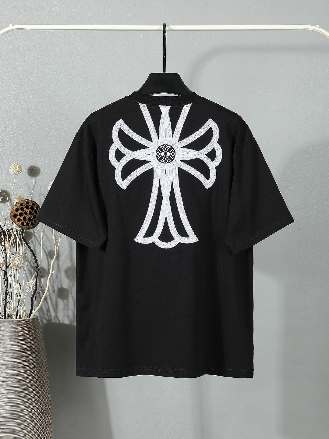 Black short-sleeve T-shirt with large white back floral graphic centered