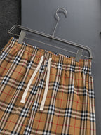 Plaid shorts waist with elastic waistband and white drawstring ties