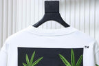 Off-white sweatshirt back with cannabis-leaf graphic across shoulders