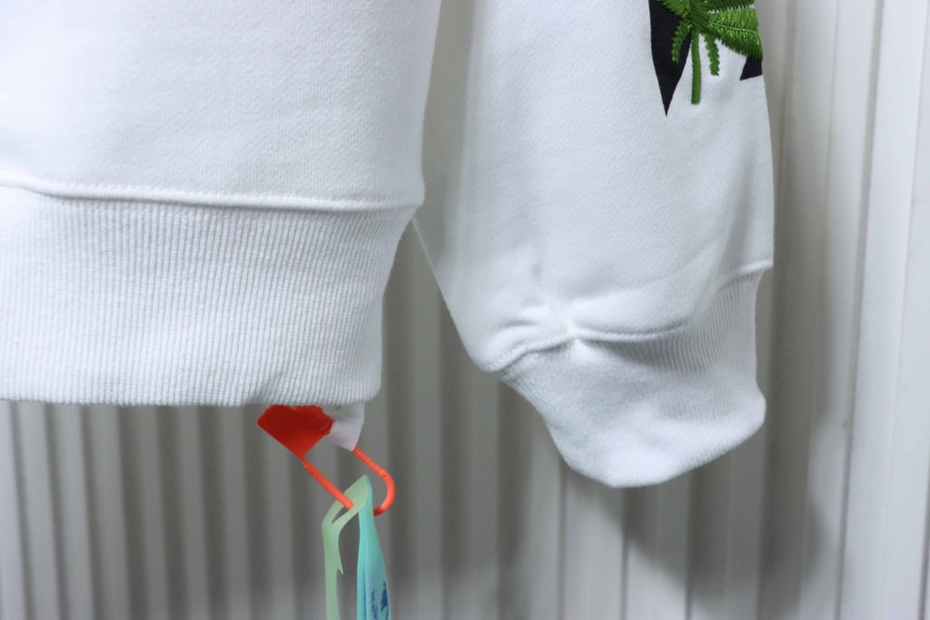 Off-white sweatshirt cuff and hem with hanging leaf graphic detail