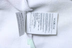 Off White hoodie care labels on white fabric tag with washing and sizing info