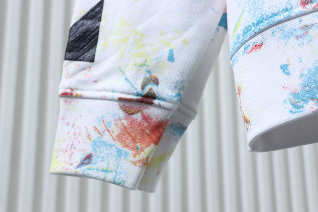 Off White hoodie sleeve cuff with watercolor splatter in blue, orange and red