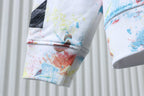Off White hoodie sleeve cuff with watercolor splatter in blue, orange and red