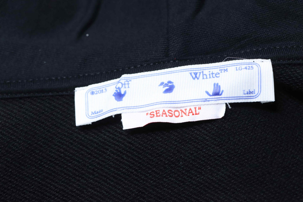 Black hoodie with neck label and Seasonal size tag