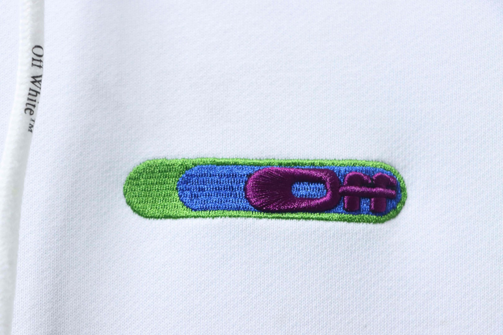 Off-White off-white hoodie small multicolor stripe logo patch near chest.