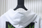 Off-White off-white hoodie close-up of back hood and green leaf print panels.