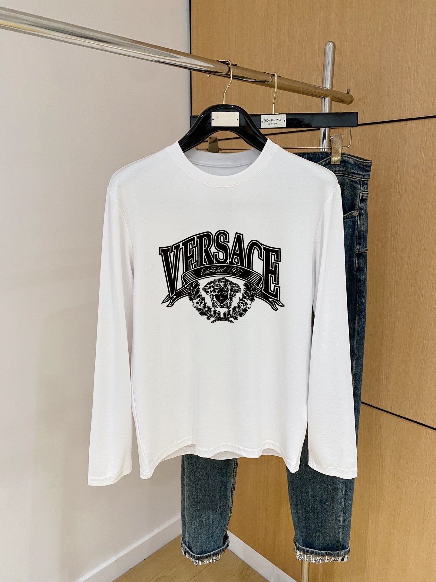 Long-sleeve crewneck top in white with Versace front graphic print