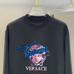 Navy long-sleeve T-shirt close-up of VERSACE face and script logo print