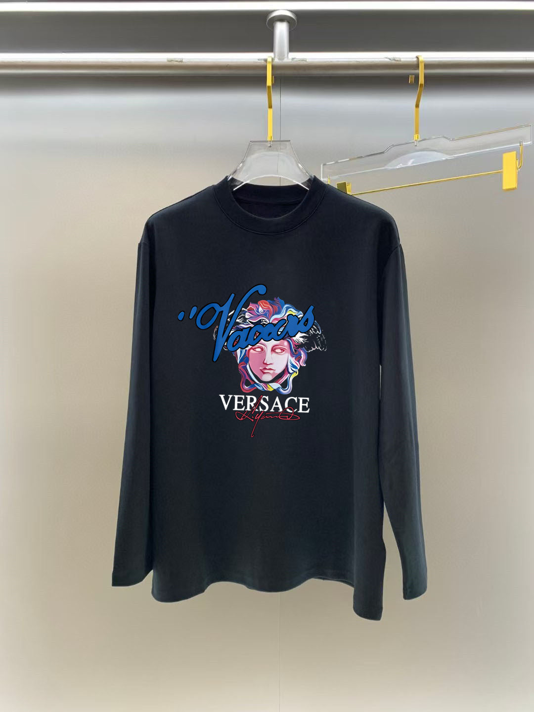 Blackened navy long-sleeve T-shirt with VERSACE face and script logo print at front