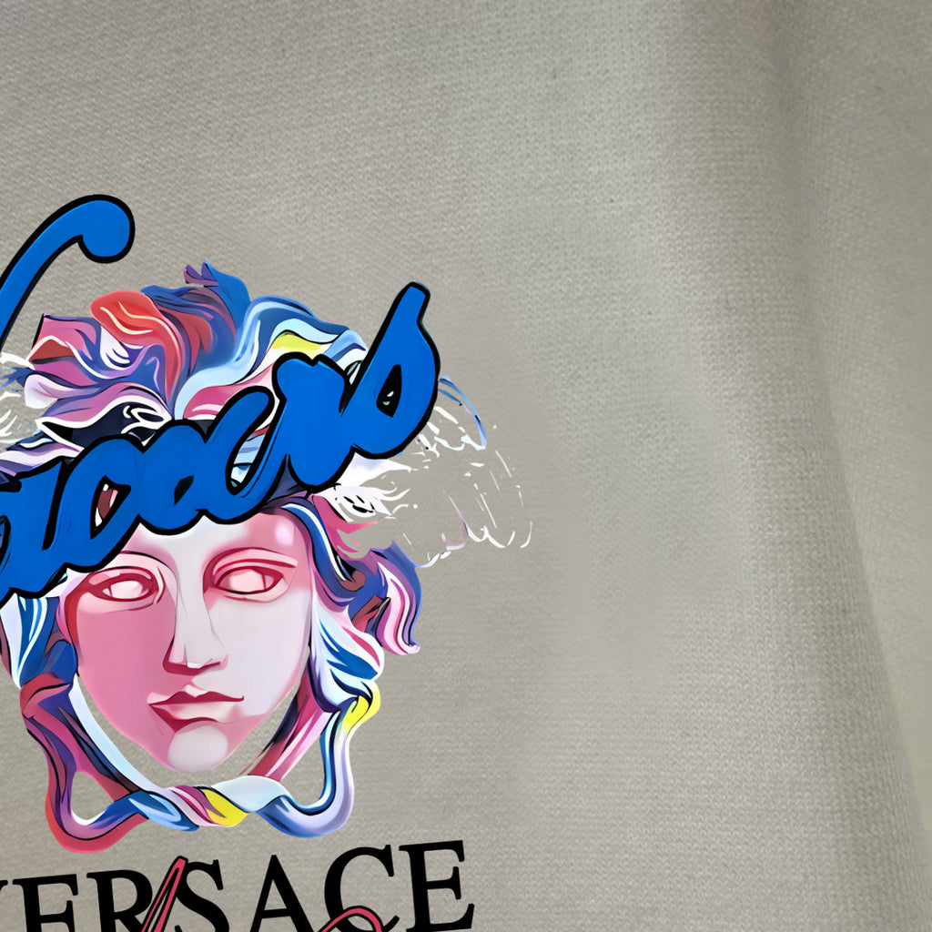 White T-shirt fabric close-up with colorful VERSACE face graphic