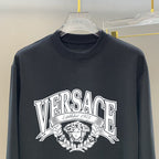 Versace long-sleeve T-shirt, dark navy, close-up of front logo graphic
