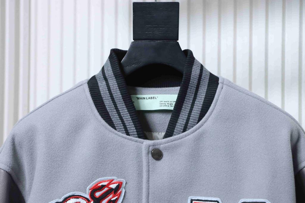 Off White grey jacket collar with black ribbed trim and snap button
