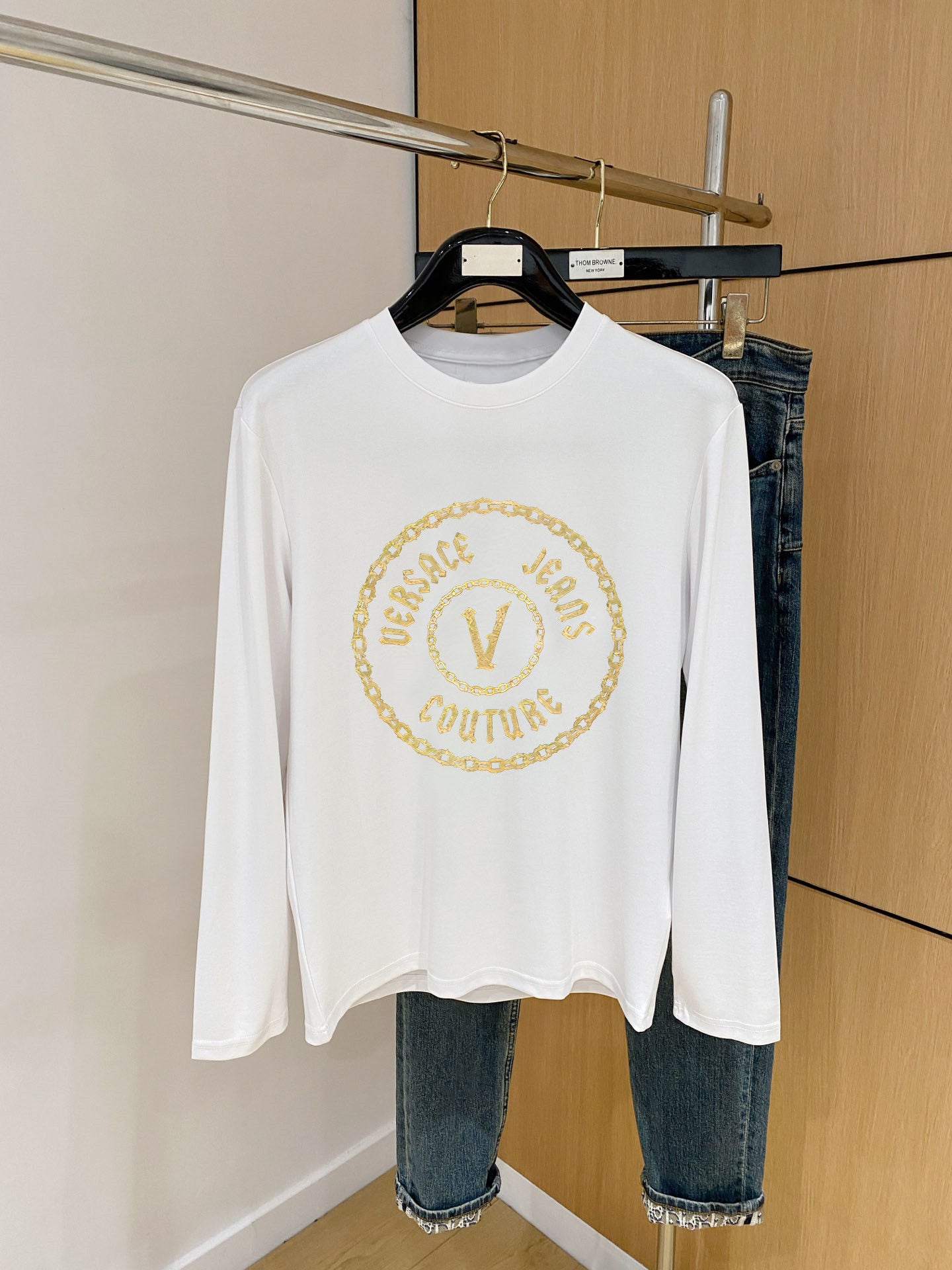 Versace white long-sleeve shirt with gold circular V logo print at chest
