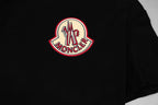 Black Moncler T-shirt with large circular logo on the chest