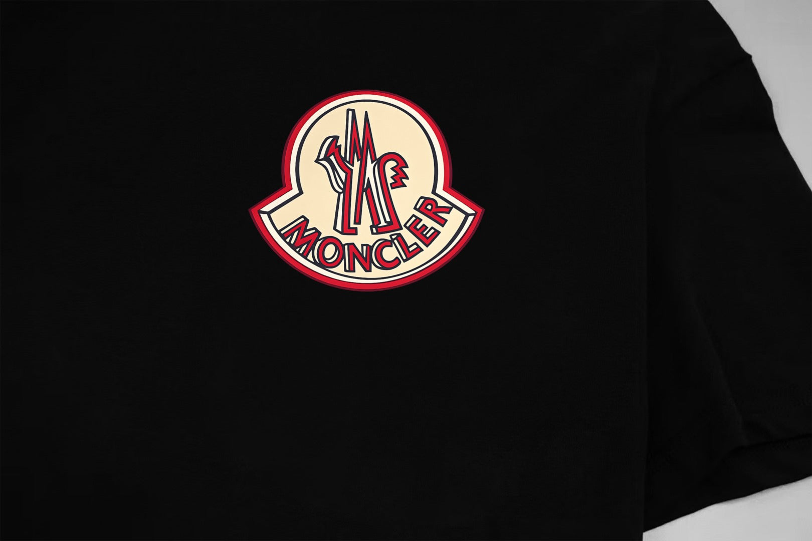 Black Moncler T-shirt with large circular logo on the chest