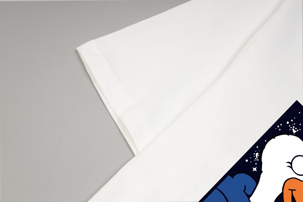 White T-shirt sleeve with partial colorful graphic print