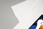 White T-shirt sleeve with partial colorful graphic print