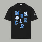 Black crew-neck short-sleeve T-shirt with blue MONCLER graphic and logo patch