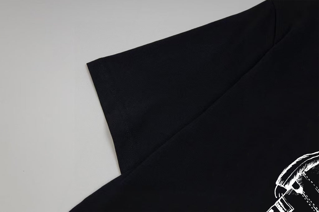 Black T-shirt shoulder seam and sleeve opening detail