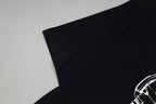 Black T-shirt shoulder seam and sleeve opening detail
