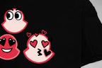 Black T-shirt with red cartoon faces and hearts graphic