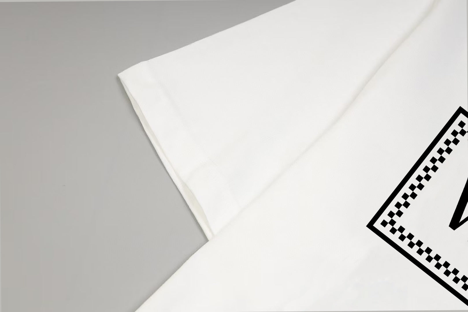 Versace white T-shirt sleeve and shoulder seam detail