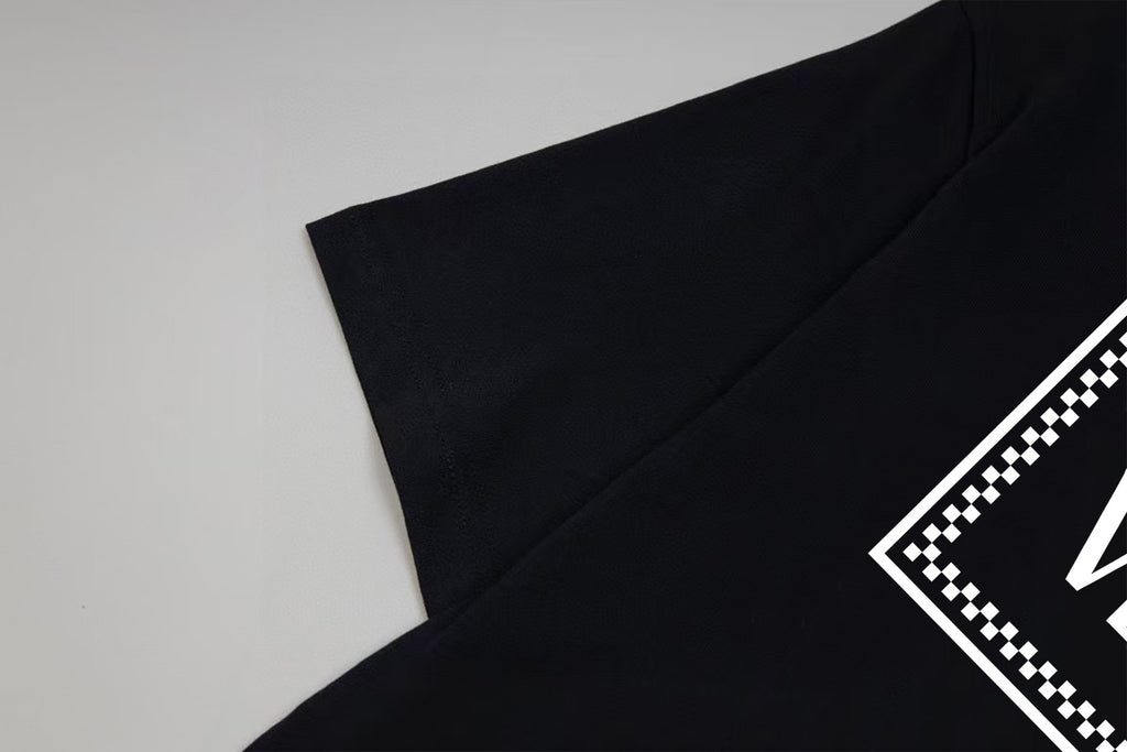 Black Versace T-shirt sleeve and side with checker trim edge