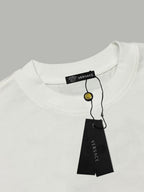 White crew-neck T-shirt with black brand tag on neckline