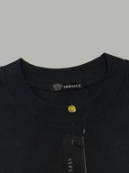 Black Versace T-shirt neckline with brand tape and snap tag